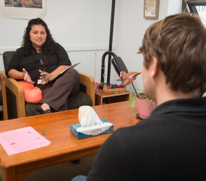 Counselor speaks to student