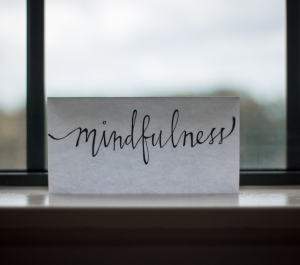 The word "mindfulness" on a piece of paper